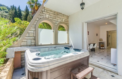 Agios Gordios Apartment | Doliva Anthi Apartment with Private Hot Tub, Mountain View, Wi-Fi, and Air Conditioning