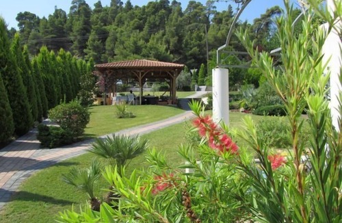 Polichrono Apartment | Holiday Apartment in Pallini with Private Terrace and Garden View