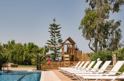 Houdetsi Villa | Tsourlakis Residence, A Tranquil Family Oasis with Pool, By ThinkVilla