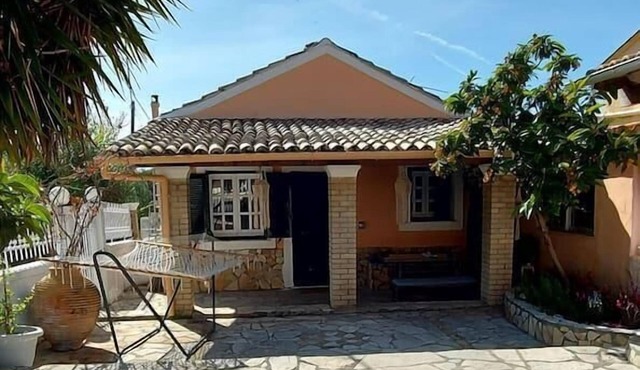 a flower house in Corfu close to beach and town