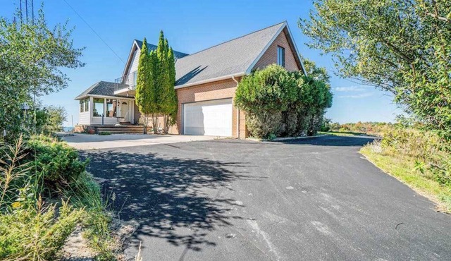 Dog-friendly, lake view home with three season room, fireplace, video projector in Arcadia