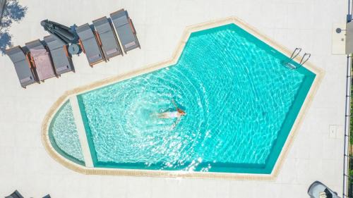 Lefkothea Villas with Large Pool, BBQ & Playground by Rentado